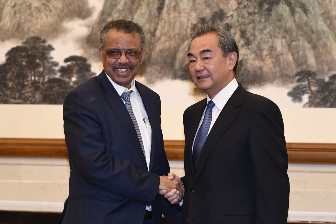 WHO Director-General Tedros Adhanom Ghebreyesus and Chinese Foreign Minister Wang Yi