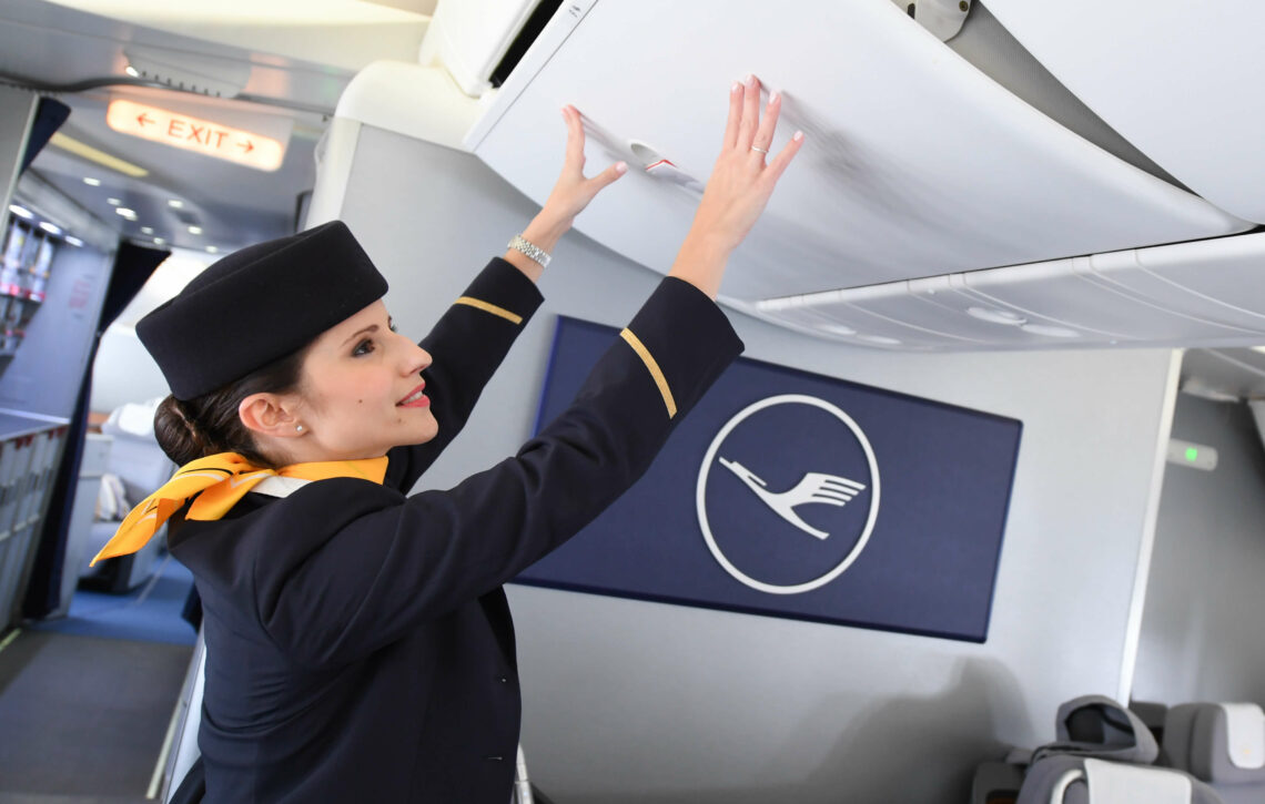 Lufthansa flight attendant during boarding