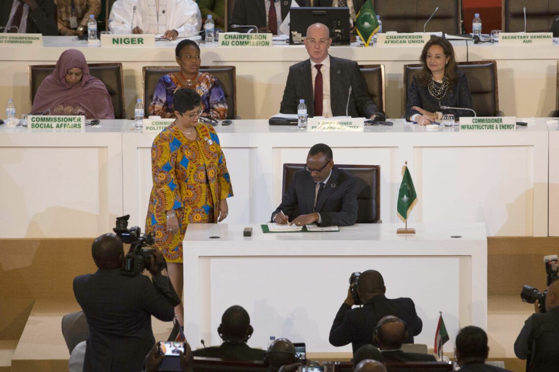 Rwandan President Paul Kagame signs an agreement establishing the African Continental Free Trade Area (AfCFTA) in Kigali, Rwanda, on March 21, 2018