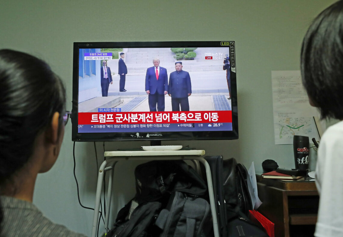 Seoul residents watching a broadcast of the meeting between the U.S. and North Korean leaders