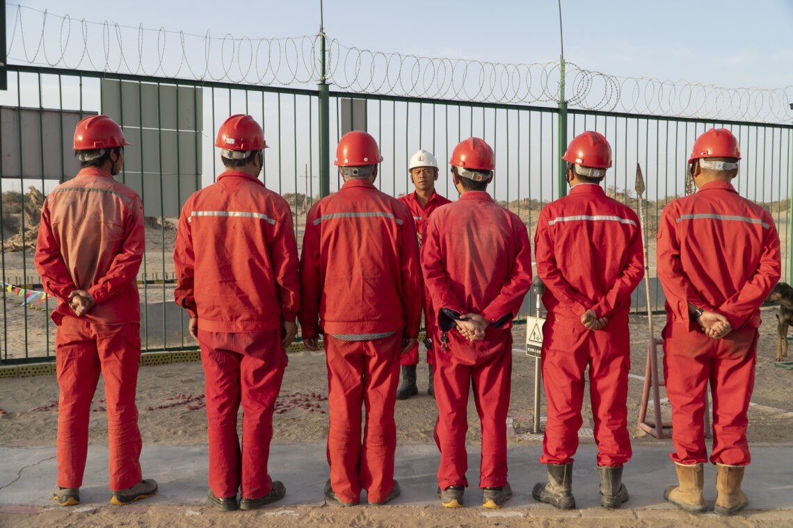 Oil workers hold a meeting at the Shunbei oil-gas field of China Petrochemical Corporation