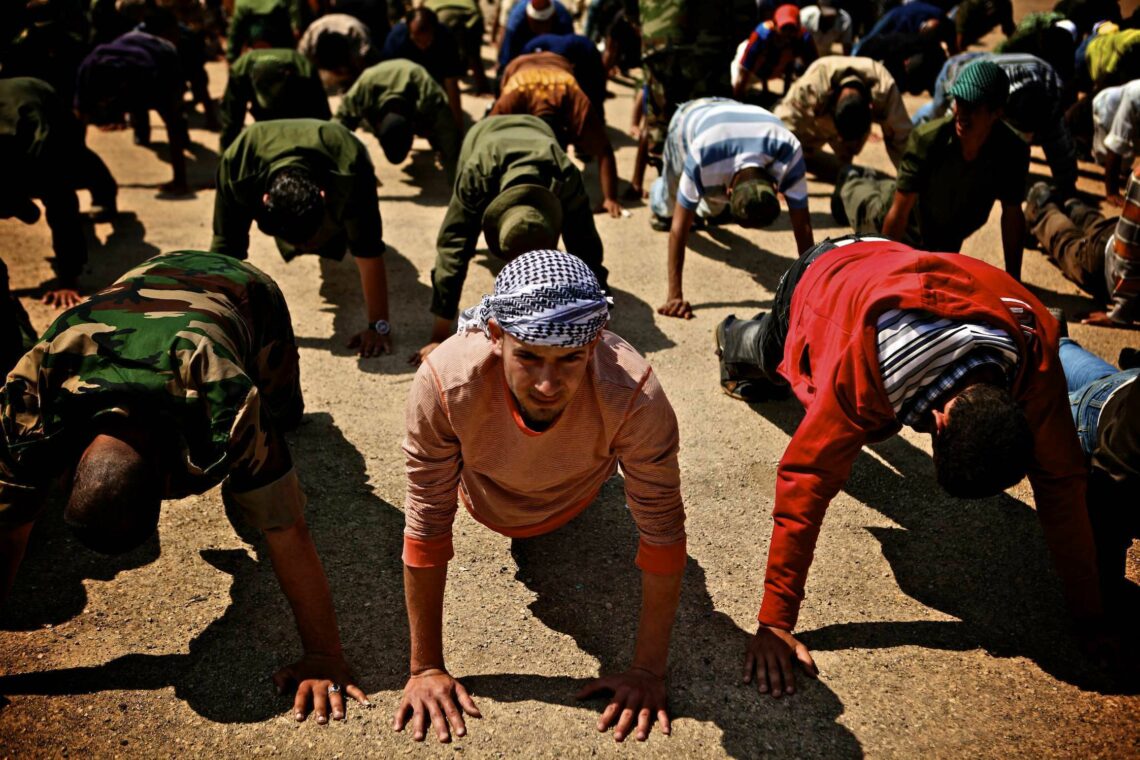 Libyan militiamen exercising at a training station