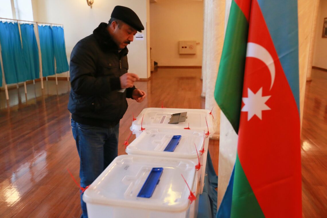 A man casting his ballot in Baku