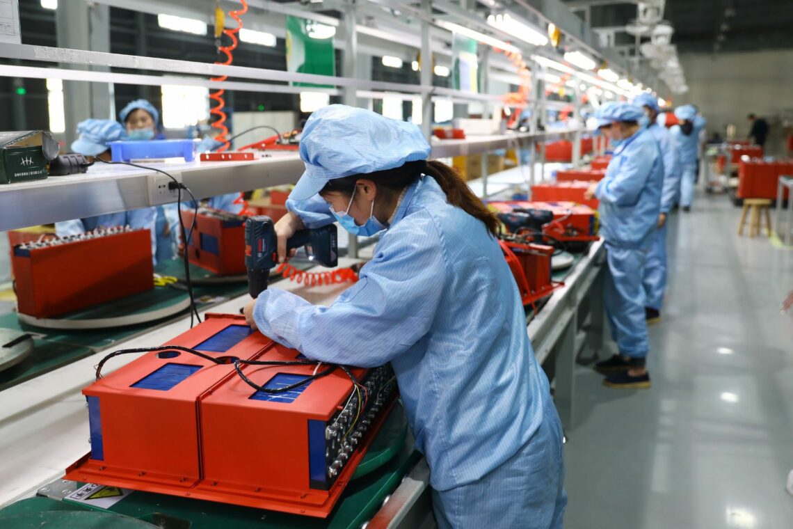Workers assemble lithium batteries in a factory in Huaibei
