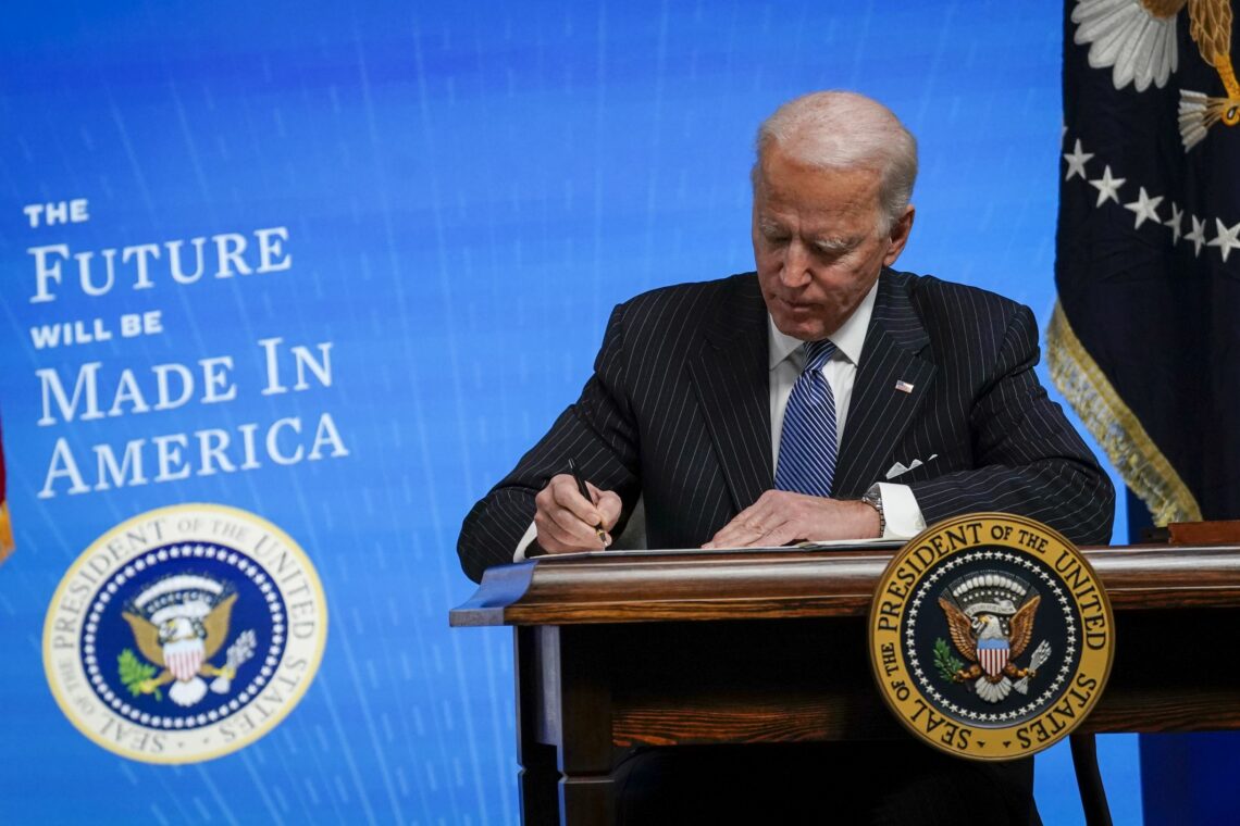 U.S. President Joe Biden signs an executive order to boost manufacturing