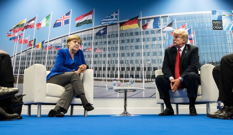 German Chancellor Angela Merkel and U.S. President Donald Trump sitting for bilateral talks on July 11, 2018 in Brussels, Belgium