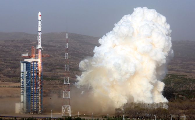 A Chinese rocket with two satellites on board lifts off