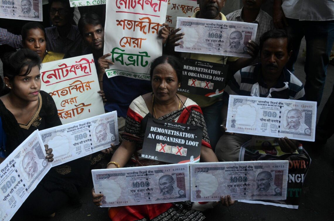Indian activists protest at a 2017 rally against demonetization