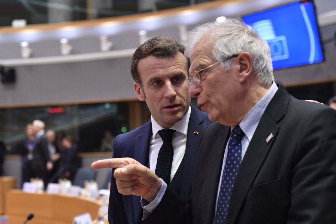 French President Emmanuel Macron talks with Josep Borrell Fontelles, High Representative of the Union for Foreign and Security Policy at the European Commission, ahead of roundtable talks at a European Union summit in Brussels, Belgium, on, Feb. 20,