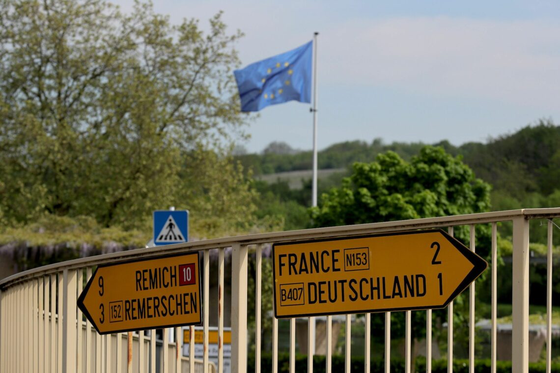 Direction signs point to Germany and France in the town of Schengen, Luxembourg where the 1985 European Schengen Agreement was signed.