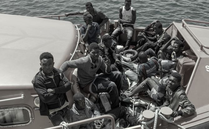 Migrants arrive in a Spanish harbor in July 2018