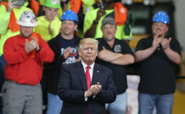 A picture showing the president of the United States and construction workers clapping hands U.S. infrastructure