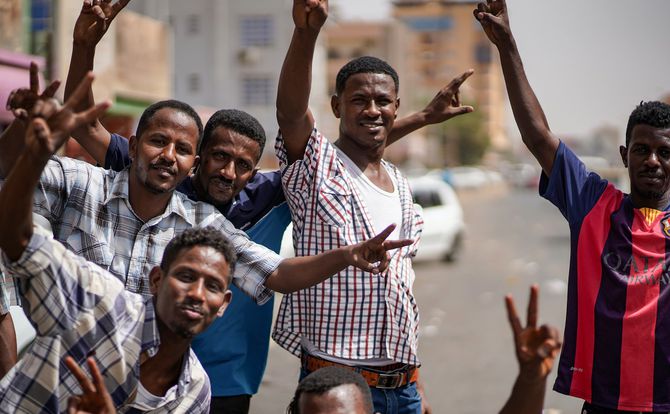 Protesters in Khartoum celebrate the ouster of Sudanese President Omar al-Bashir
