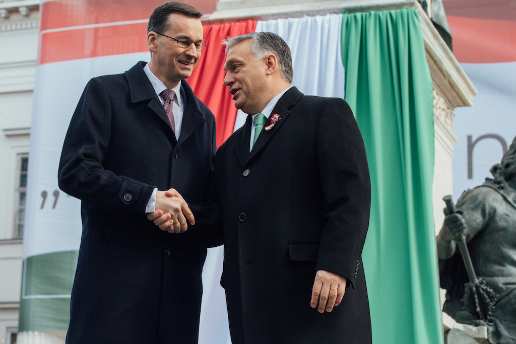 Prime ministers of Hungary and Poland shake hands during celebrations of Hungary’s National Day in Budapest in 2019