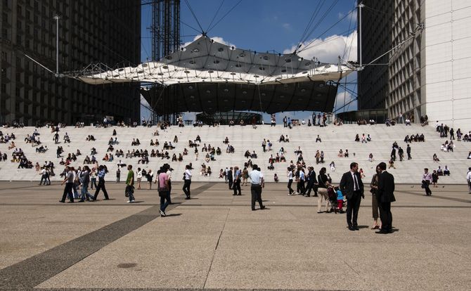 Office workers break for lunch at the Grande Arche in the La Defense district of Paris