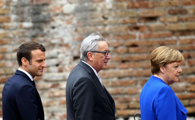 French President Emmanuel Macron, European Commission President Jean-Claude Juncker and German Chancellor Angela Merkel Economic imbalances Western economies
