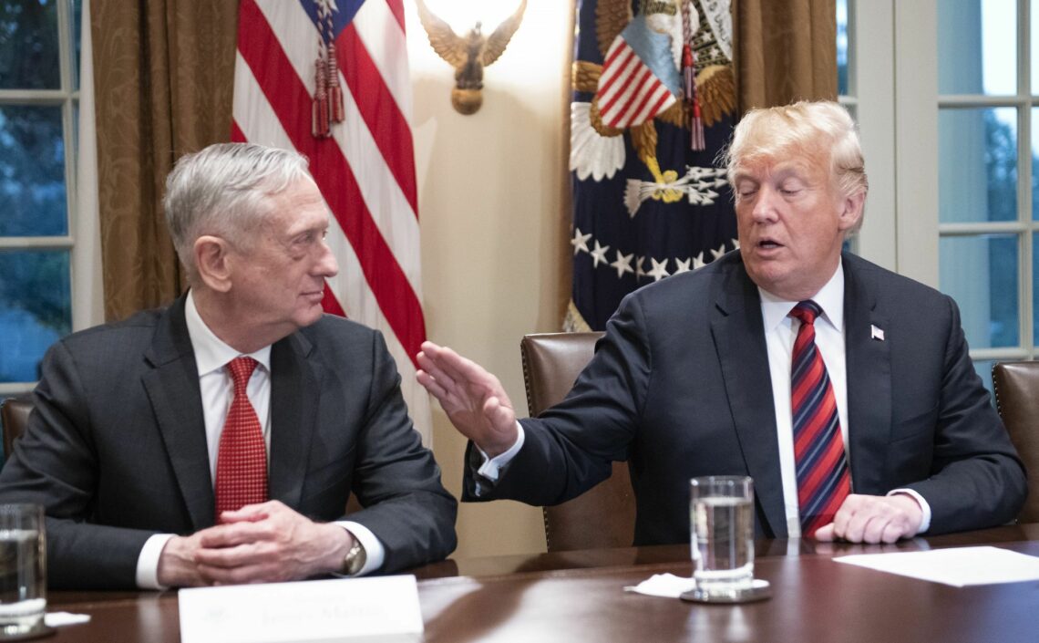 U.S. President Donald Trump gestures toward Defense Secretary James Mattis at a meeting in the White House