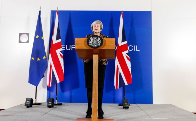 British Prime Minister Theresa May gives a press conference during a European Council summit in Brussels