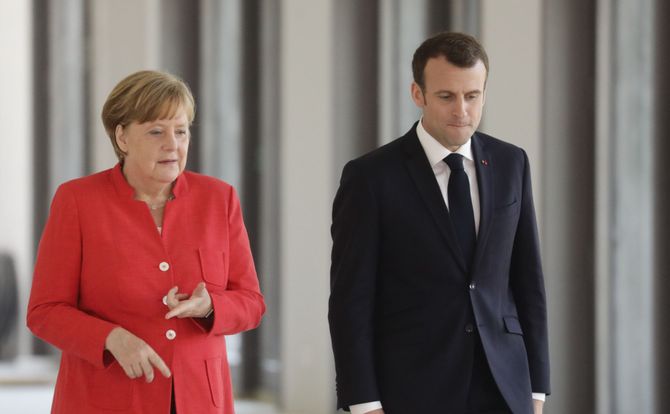 German Chancellor Angela Merkel and French President Emmanuel Macron policies endanger bloc
