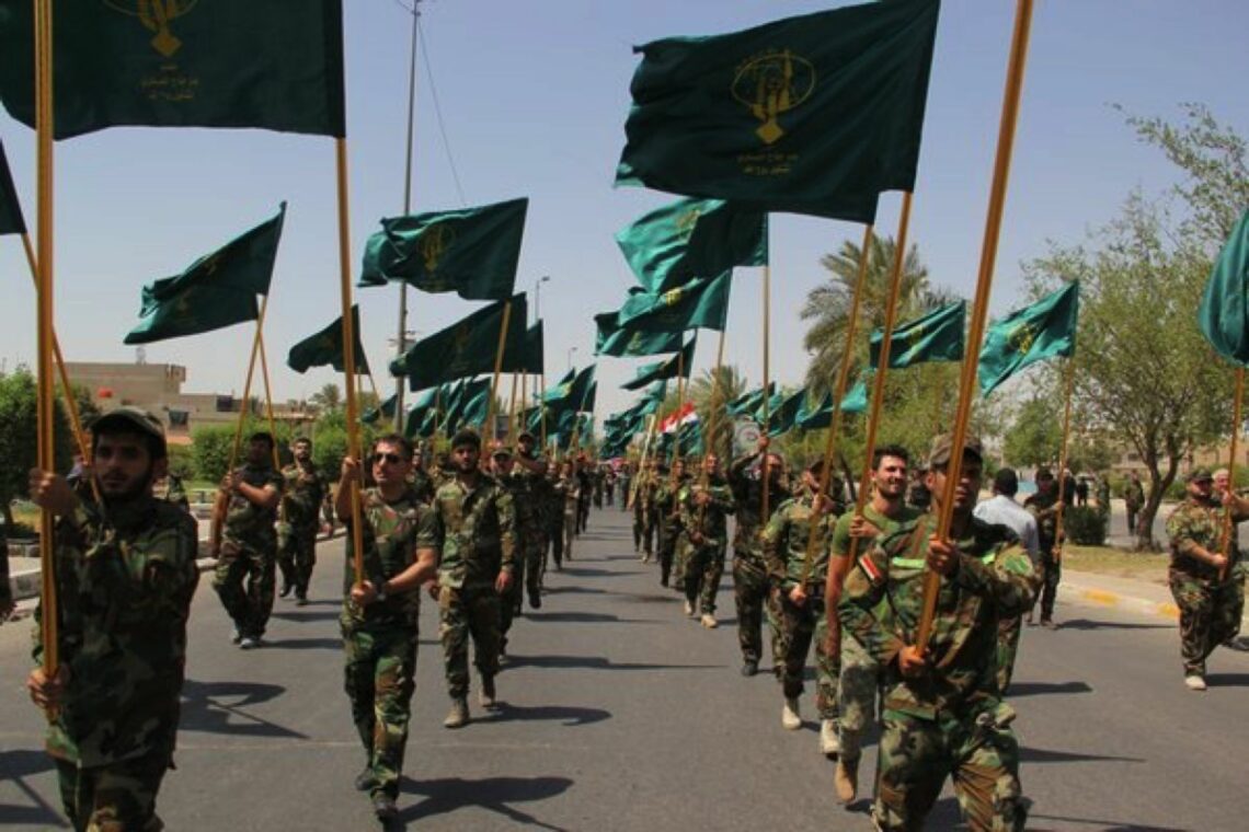 Iranian-backed Shia militias march in Iraq