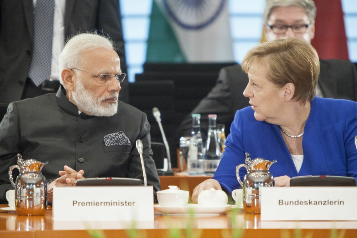 Indian Prime Minister Narendra Modi and German Chancellor Angela Merkel chat during a meeting in Berlin on May 30, 2017