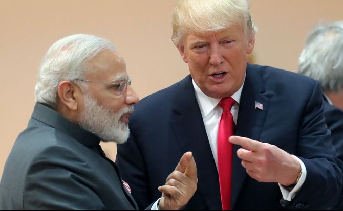 U.S. President Donald Trump and Indian Prime Minister Narendra Modi talk on the sidelines of a G20 summit