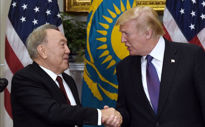 Kazakhstani President Nursultan Nazarbayev shakes hands with U.S. President Donald Trump in Washington, January 2018