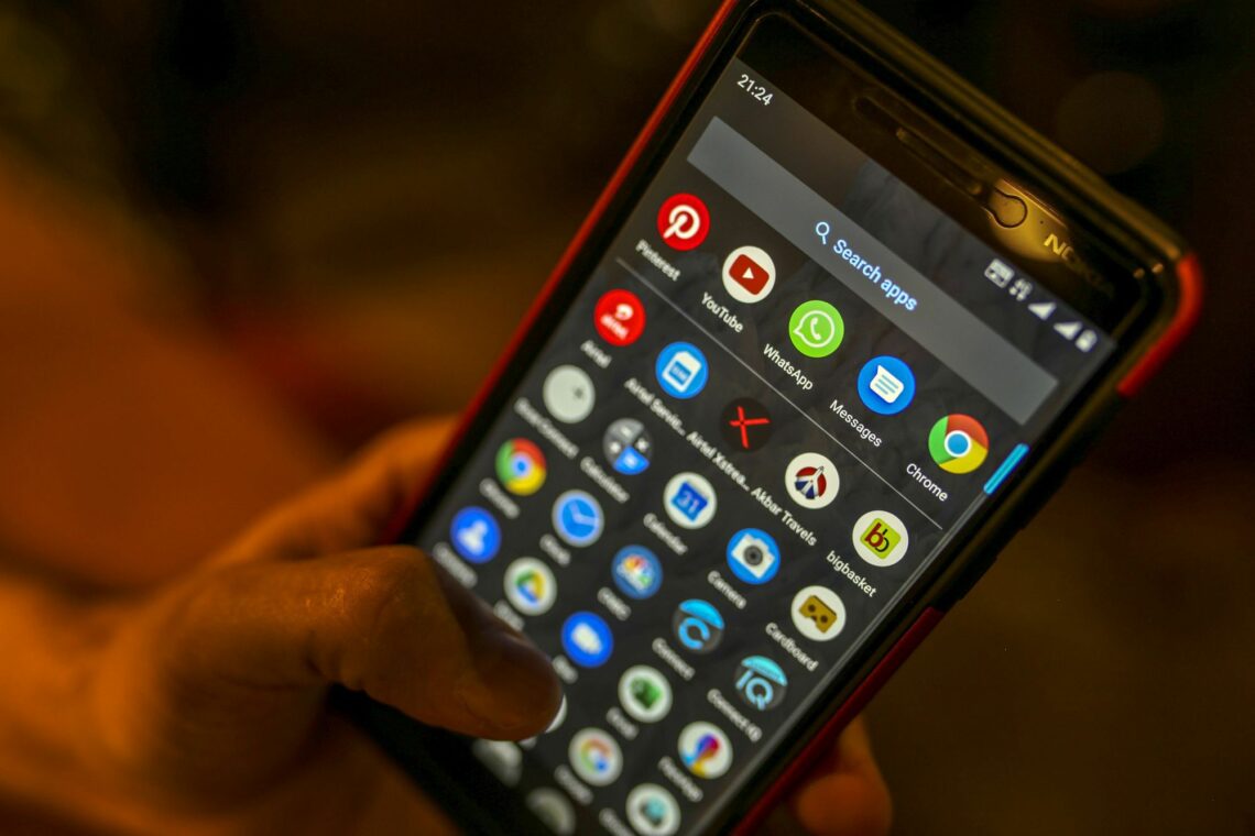 A smartphone with many apps on it