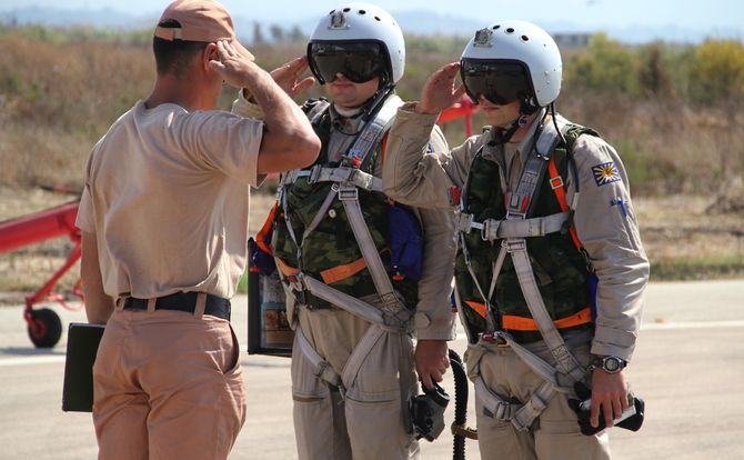 Russian pilots discuss aircraft readiness with a mechanic in syria