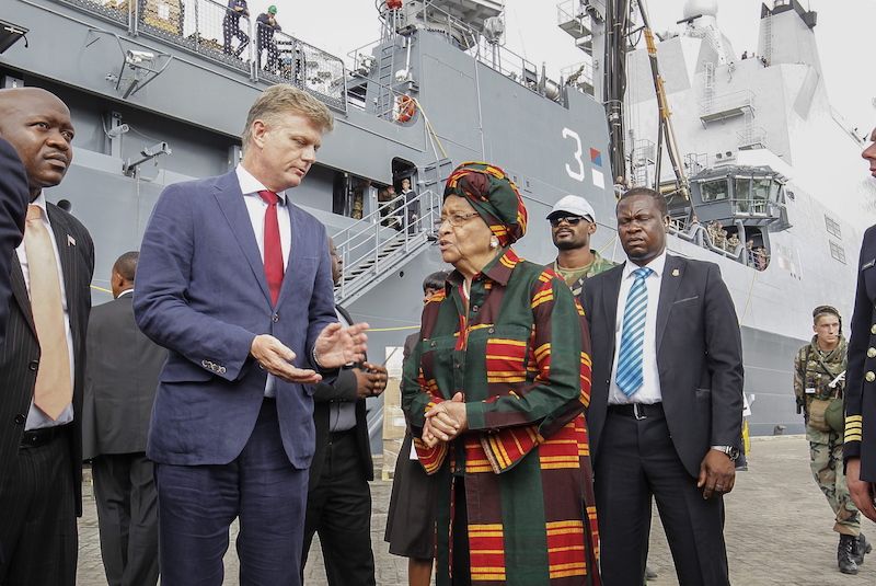 A picture showing the former president of Liberia and a Dutch health official in the port of Freetown during the outbreak of the Ebola virus restoration civil war