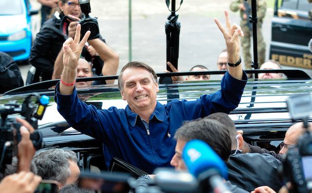 A picture that shows presidential candidate Jair Bolsonaro arriving at a polling station in Rio de Janeiro during Brazil’s 2018 general elections