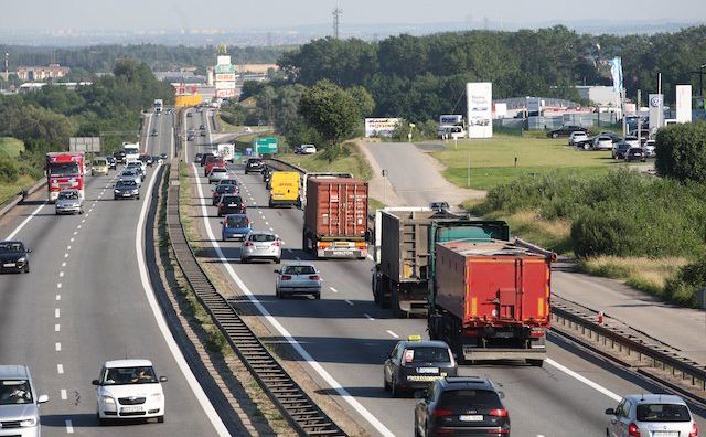 Polish companies’ heavy trucks moving down a highway