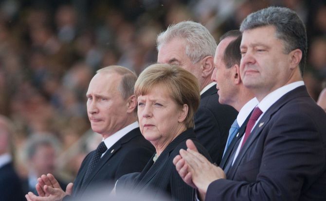 Vladimir Putin, Angela Merkel and Petro Poroshenko at a D-Day anniversary commemoration in France
