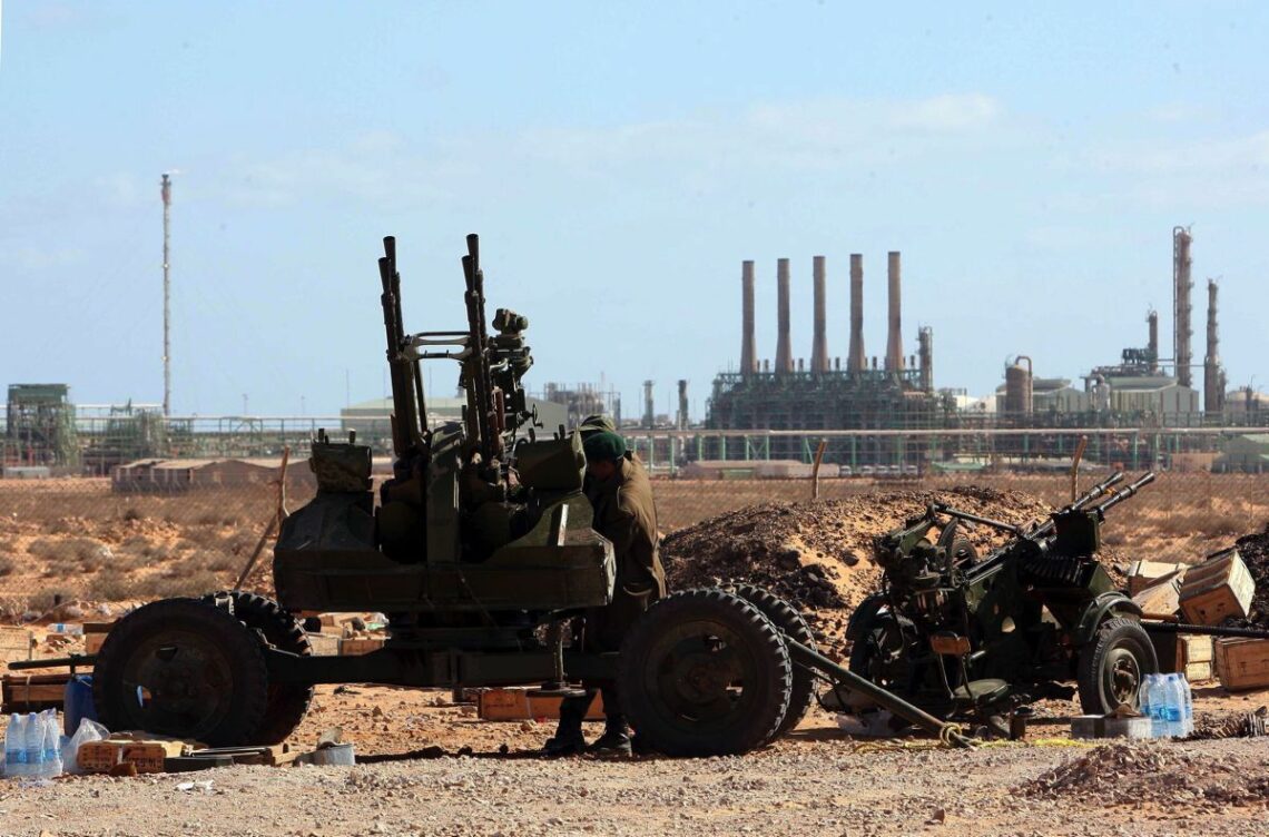 Anti-aircraft gun in front of Libya’s Ras Lanuf oil refinery