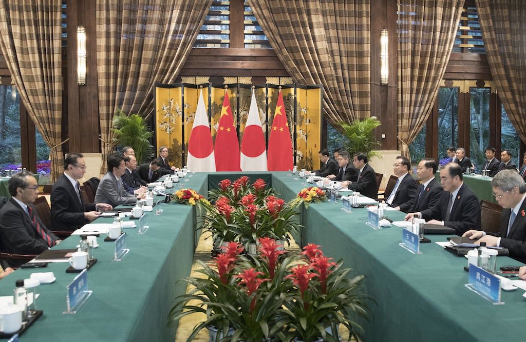 A picture showing a meeting of Chinese and Japanese officials in a southwest China province, in late 2019