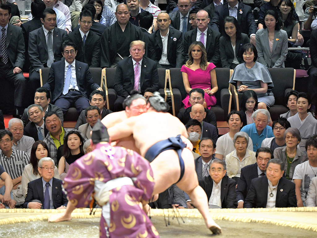 Leaders of Japan and the U.S. sit in the audience during Summer Sumo Grand Tournament at Ryogoku Kokugikan in Tokyo.