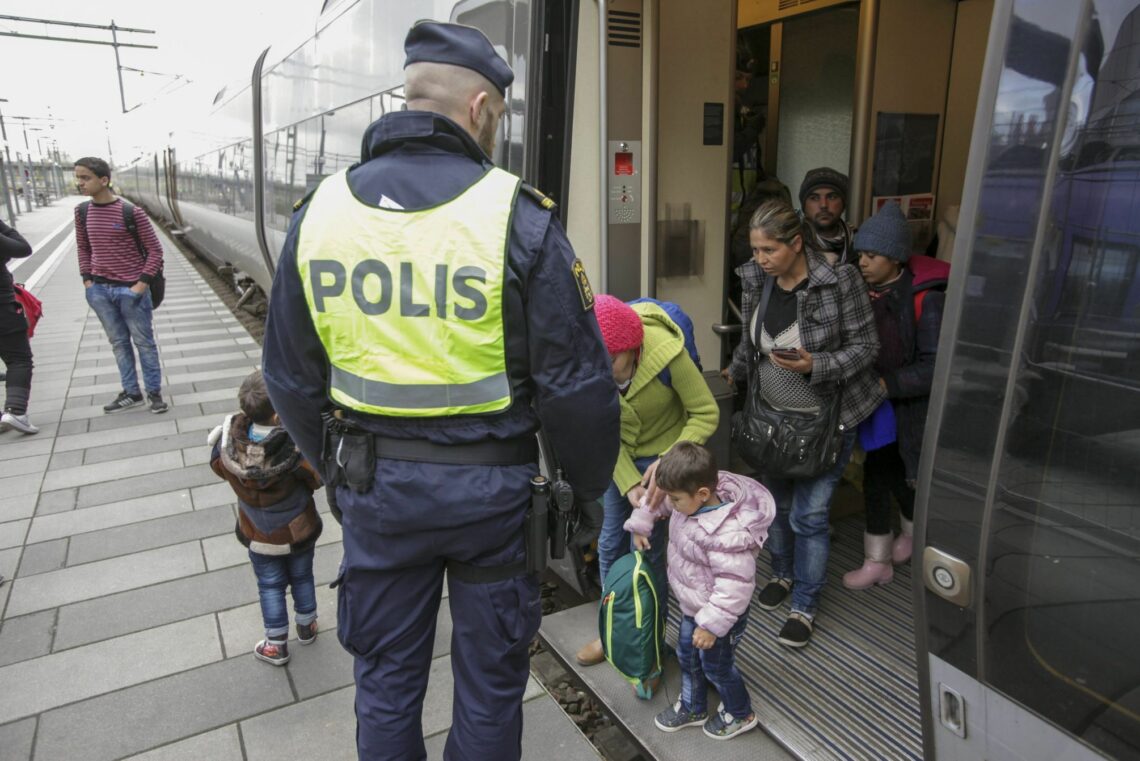 Swedish police gather a group of migrants off an incoming train from Denmark, in Malmo, November 12, 2015 European project
