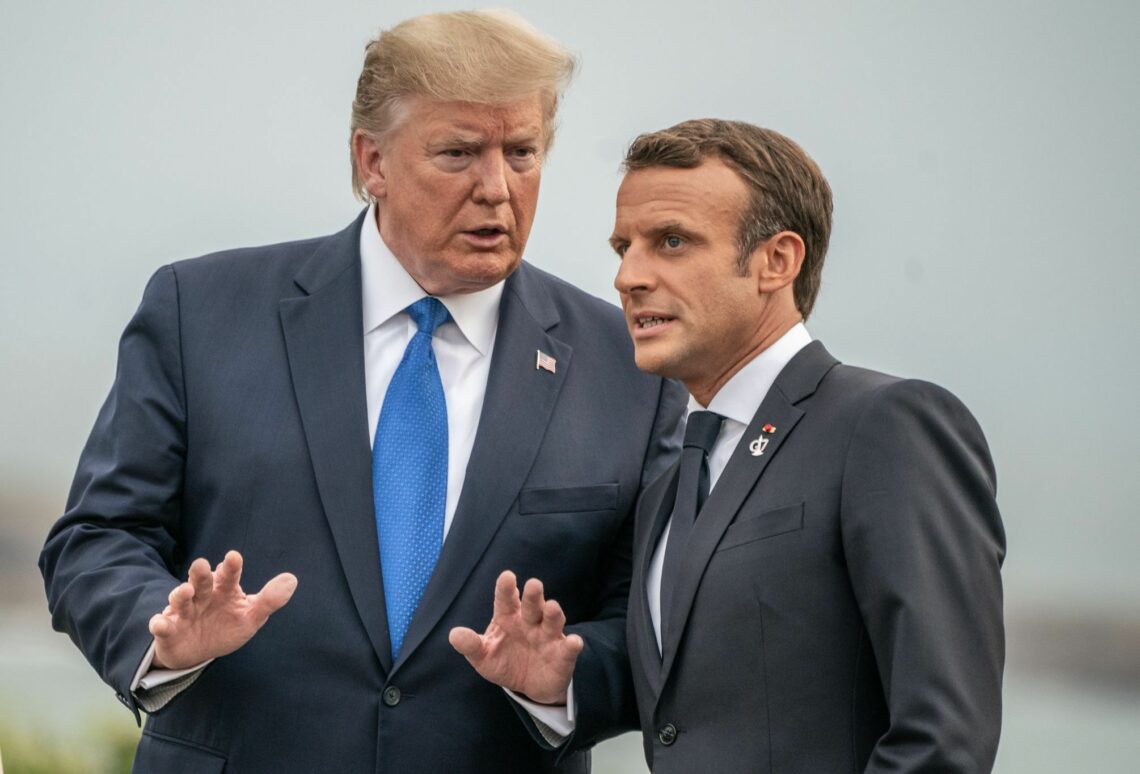 U.S. President Donald Trump and French President Emmanuel Macron talk ahead of the G7 meeting in Biarritz, France, August 24, 2019