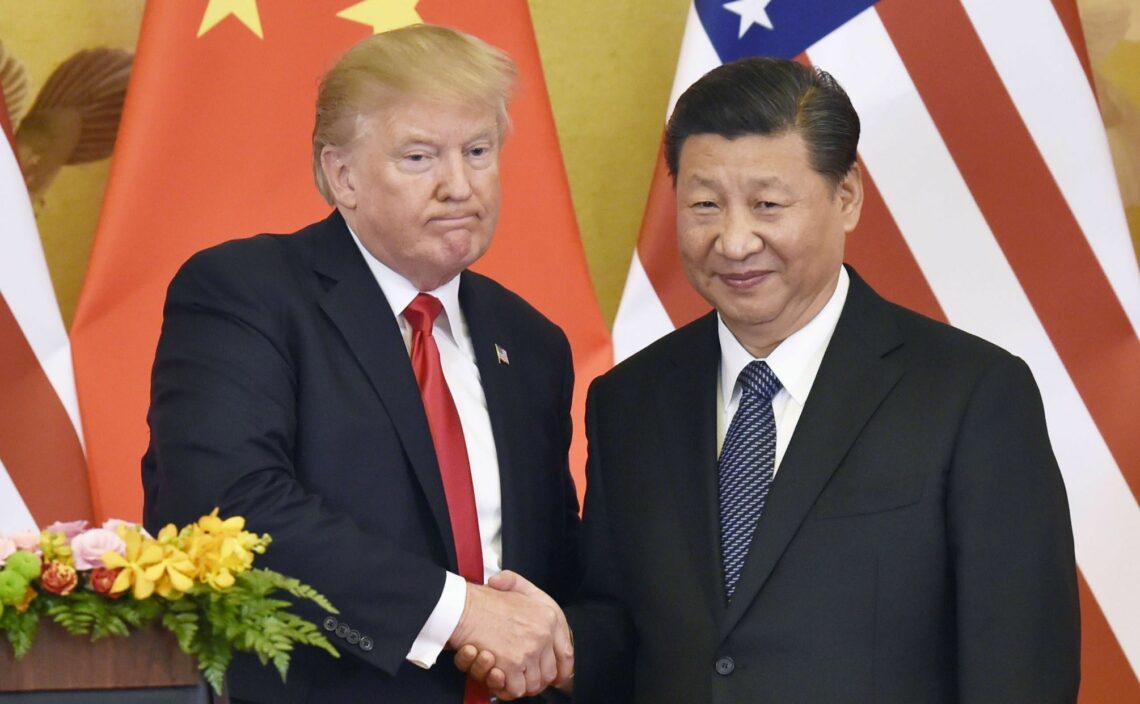 U.S. President Donald Trump (L) and Chinese President Xi Jinping shake hands at a joint news conference after their meeting in Beijing on Nov. 9, 2017 relationship Moscow Beijing Washington