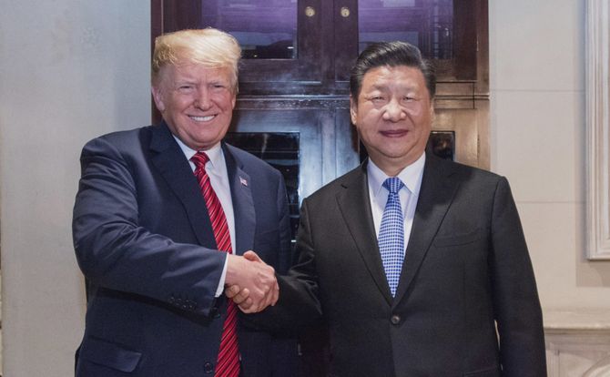 The presidents of the United States and China pose for a photograph in 2018
