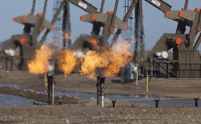 Natural gas flares from the oil production in the Bakken shale formation, in North Dakota, U.S.