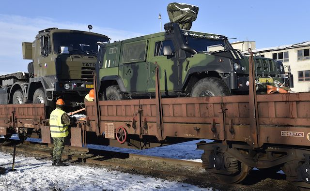 Czech army vehicles being loaded onto lorries