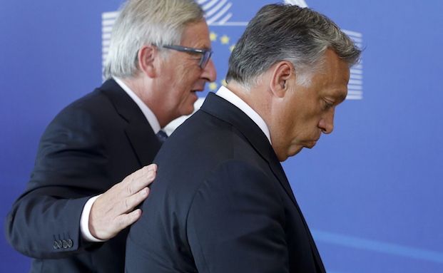 A picture showing the leader of Hungary and EU Commission President Jean-Claude Juncker Angry Brussels
