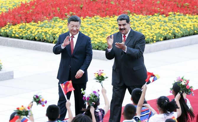 Chinese President Xi Jinping and Venezuelan President Nicolas Maduro attend a welcoming ceremony in Beijing