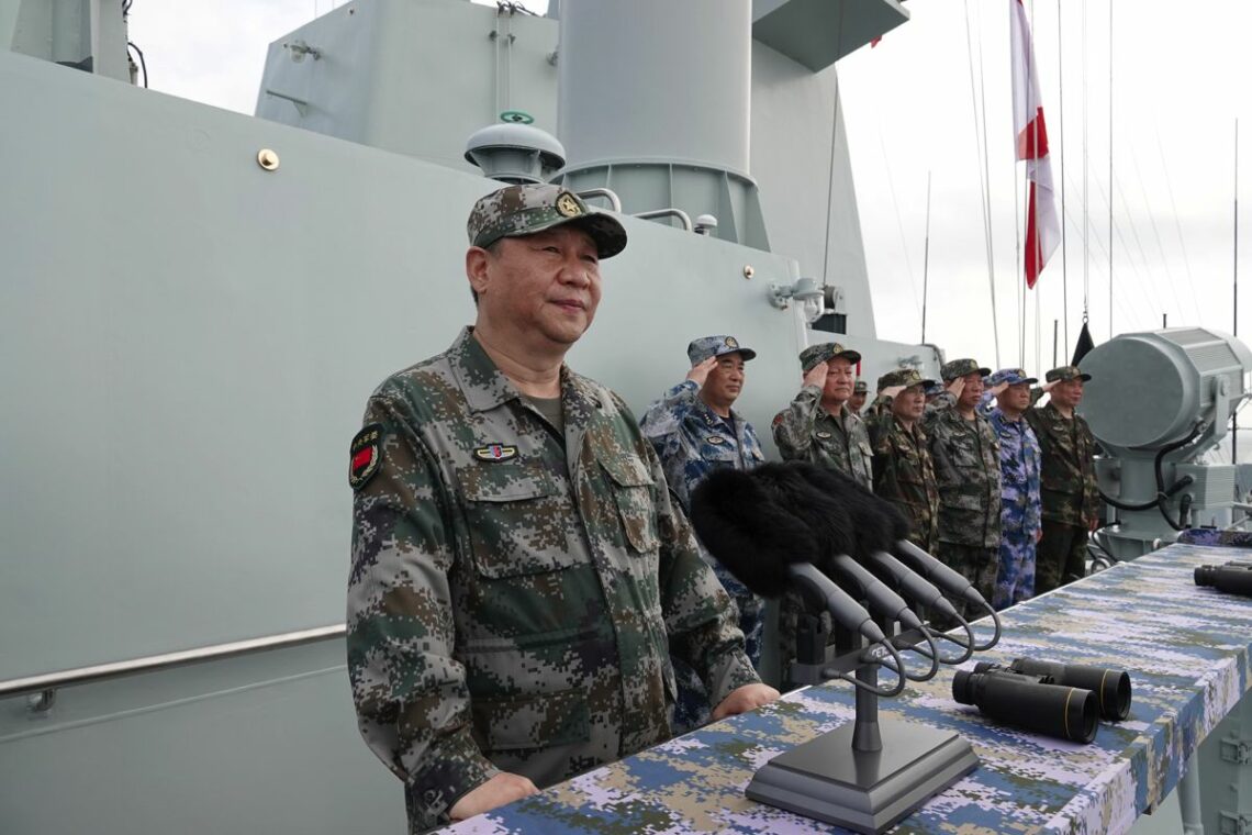 Chinese President Xi Jinping reviews naval maneuvers in April 2018 Asia collective security structure
