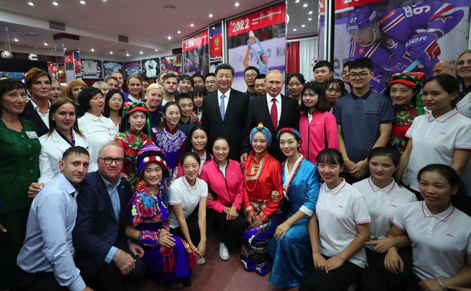 The presidents of Russia and China pose at a youth center in Vladivostok