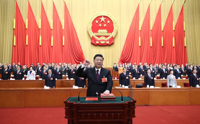 Chinese President Xi Jinping pledges allegiance to the constitution at a March session of the National People’s Congress