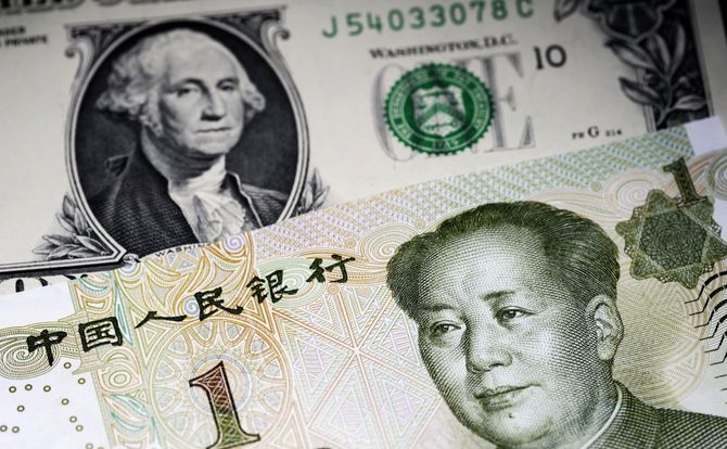 Yuan and dollar bills