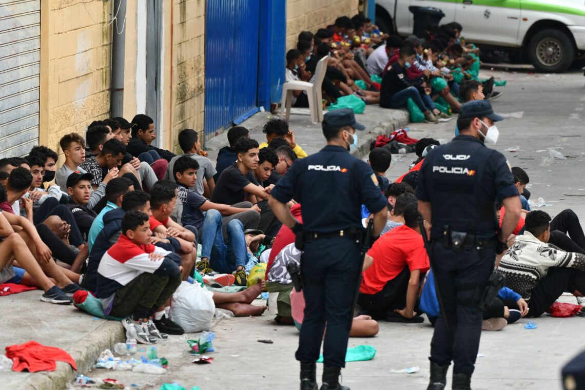Migrant minors gather at the Spanish enclave of Ceuta, on May 19, 2021 weaponized migration
