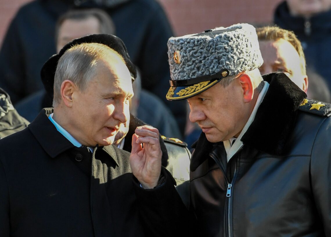 Vladimir Putin talks with Sergey Shoygu
